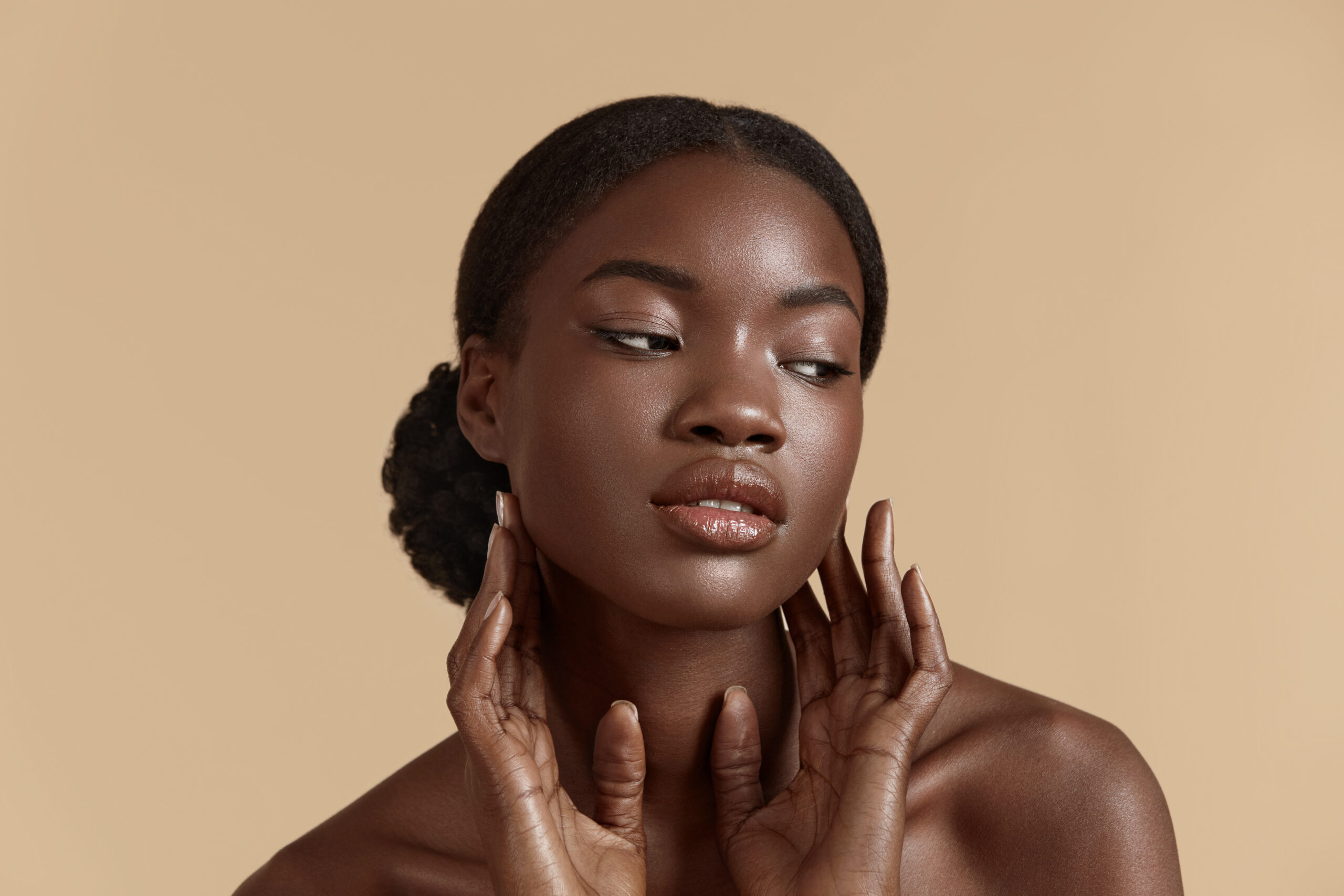Black Woman Touching Face - Skin and Aesthetics for Skin of Colour