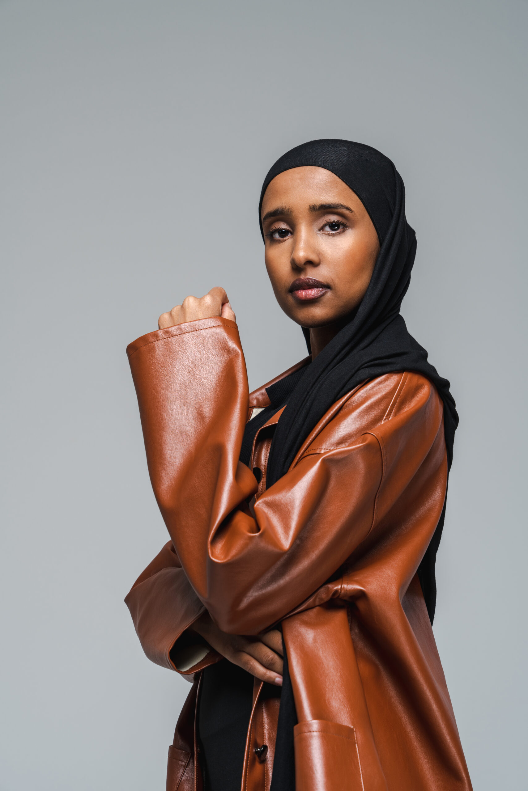 Stylish woman in a jacket and head covering